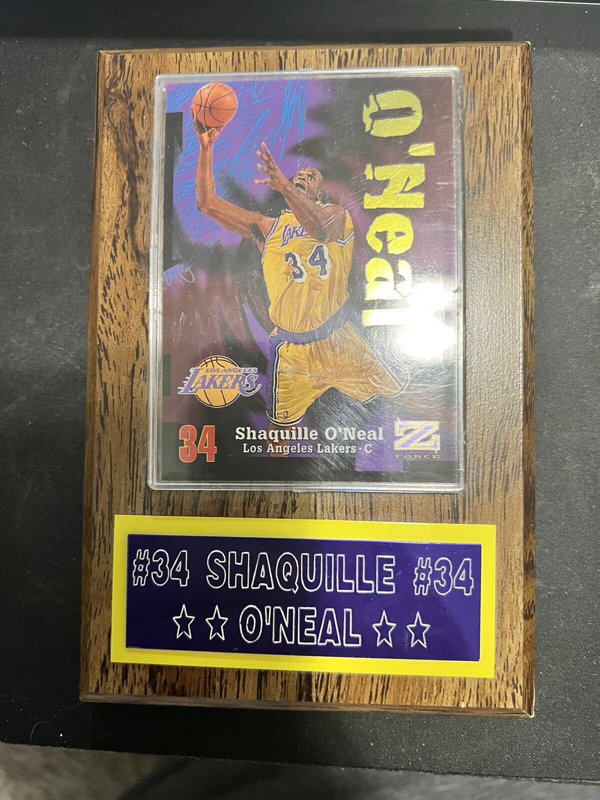 1997-1998 SkyBox Z-Force Shaquille O’Neal card mounted on a wood plaque